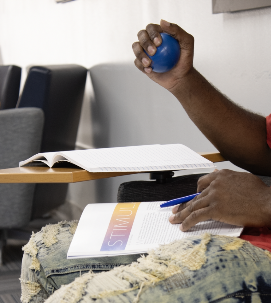An MATC student squeezes a stress ball to relieve some of his stress.